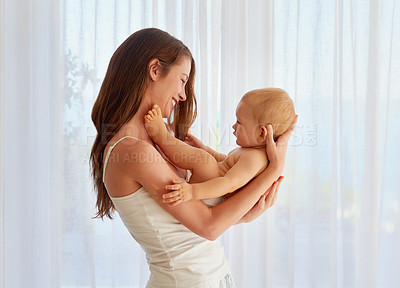 Buy stock photo Cropped shot of a mother spending quality time with her baby boy at home