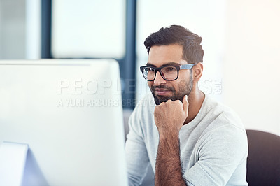 Buy stock photo Cropped shot of a young man working in his office