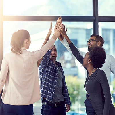 Buy stock photo Cropped shot of a group of people high fiving in the office