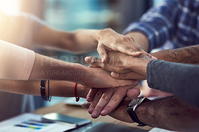 Buy stock photo Cropped shot of a group of people's hands in a huddle