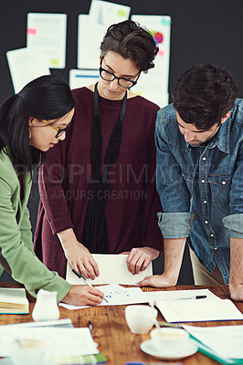 Buy stock photo Cropped shot of a group of young creatives having a meeting in a modern office