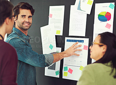 Buy stock photo Cropped shot of coworkers brainstorming in a modern office