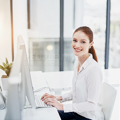 Buy stock photo Computer, portrait and smile with business woman at desk in office for online administration. Desktop, flare and typing on keyboard with happy young professional employee in workplace for report