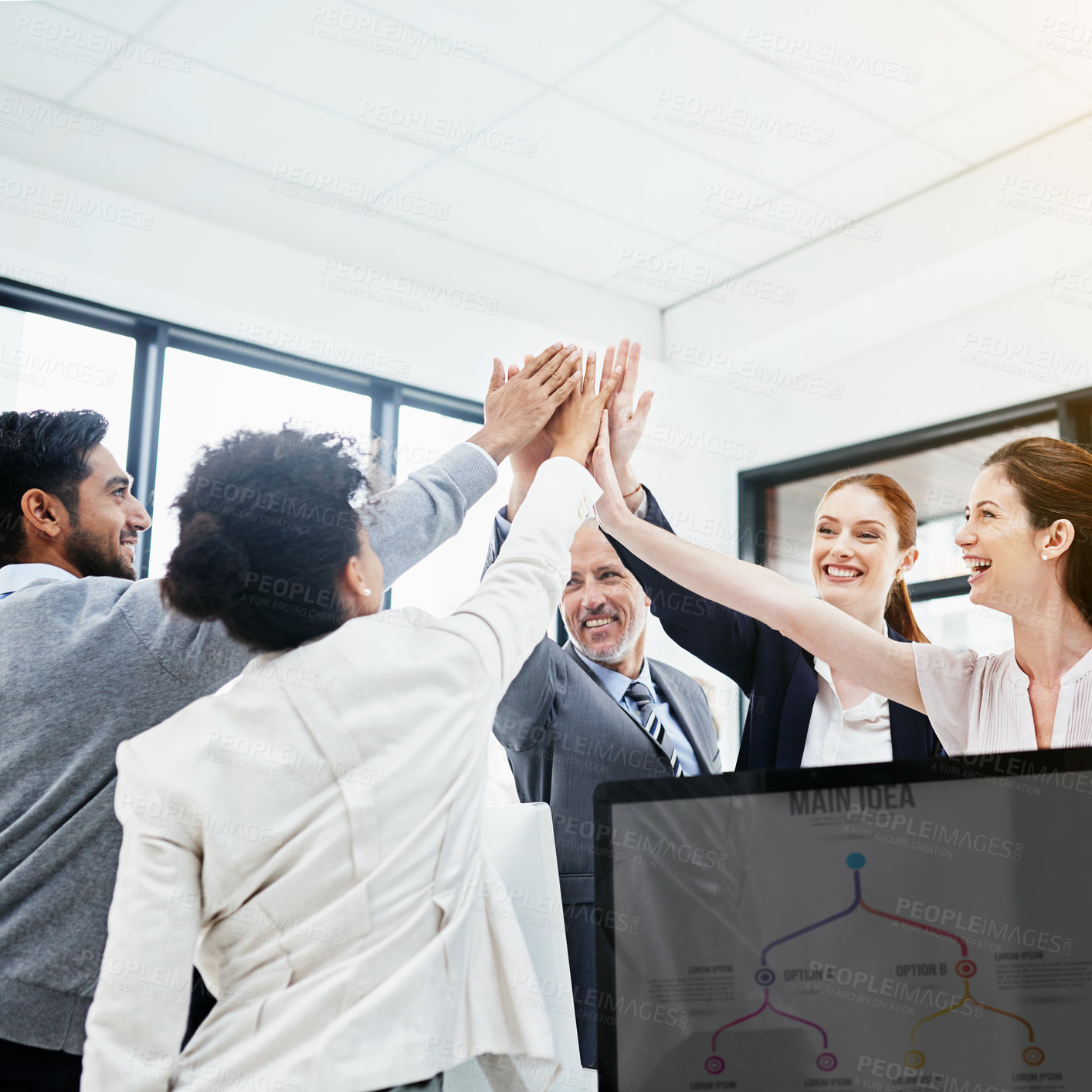 Buy stock photo Shot of a group of businesspeople high-fiving in the office