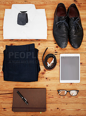 Buy stock photo Business, items and layout on floor with clothes, tablet and notebook for work trip on wood background. Glasses, shoes and setup for corporate fashion, office or travel preparation for trade show