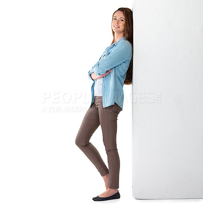 Buy stock photo Fashion, portrait and woman in studio leaning on wall for confidence, pride or denim jeans with white background. Smile, arms crossed and female model for shirt, aesthetic or trendy clothes on mockup
