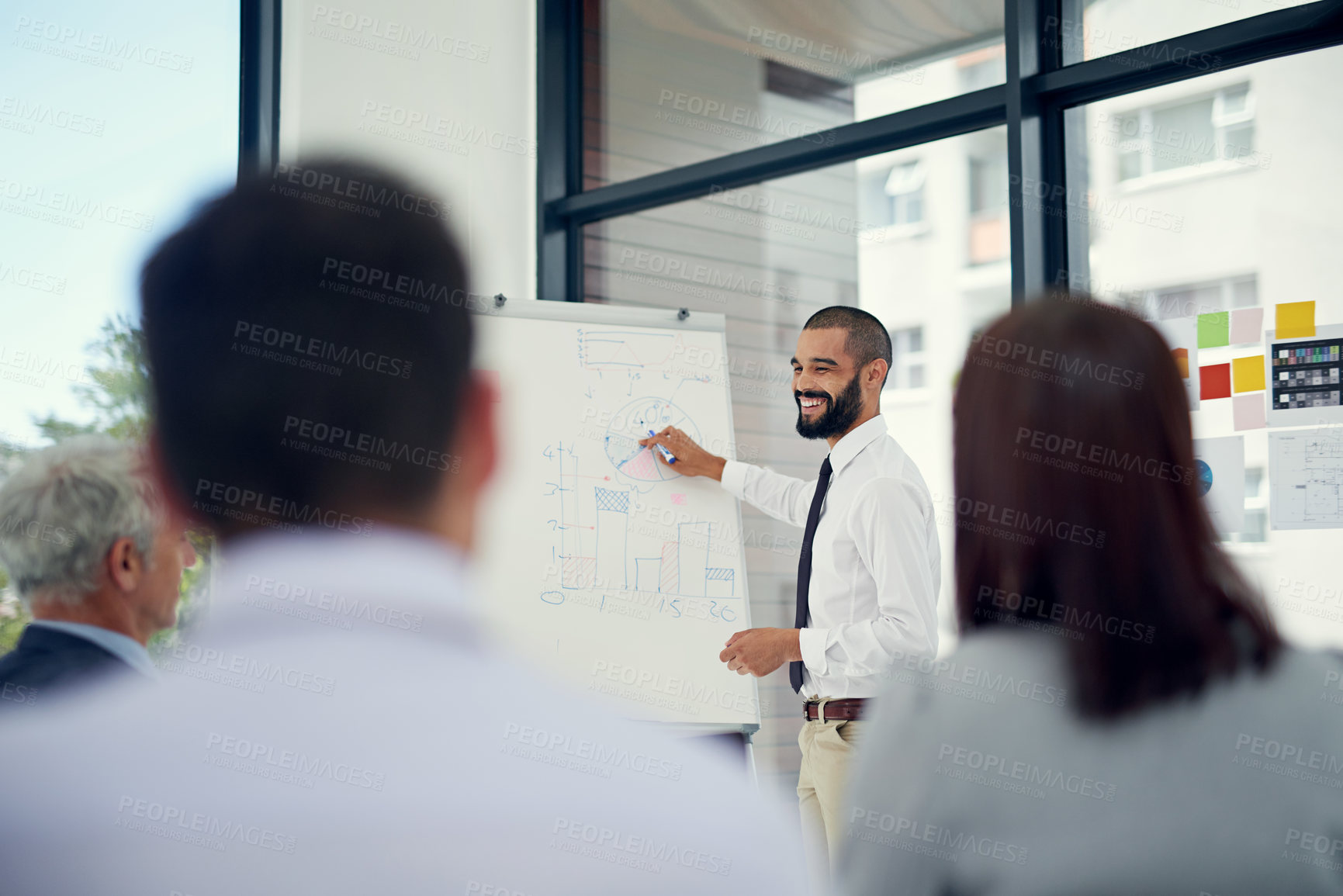 Buy stock photo Presentation, discussion and businessman at whiteboard in office for finance budget planning. Meeting, brainstorming and financial advisor with KPI review for revenue, dividend or profit goals.