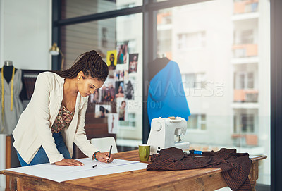 Buy stock photo Shot of a successful young fashion designer working on her latest creation