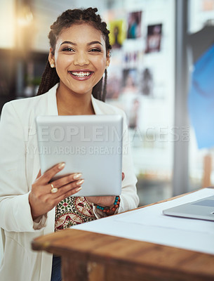 Buy stock photo Cropped portrait of a young fashion designer working on her tablet