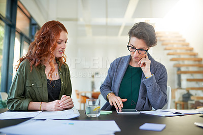 Buy stock photo Tablet, teamwork or business women in startup for news, conversation or discussion in office together. Paperwork, meeting or people planning strategy, feedback data or info online in collaboration