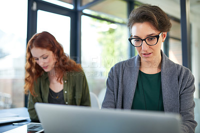 Buy stock photo Laptop, research and business women in office reading information on internet for teamwork. Technology, collaboration and professional female creative designers working on computer in workplace.