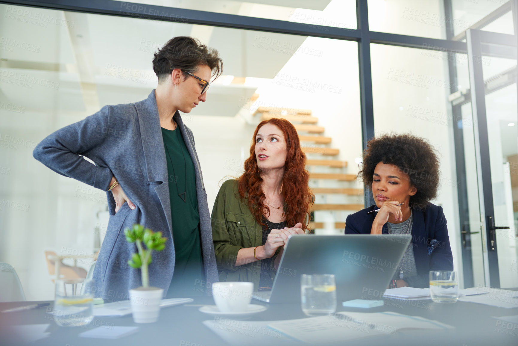 Buy stock photo Talking, teamwork or people in startup for meeting, conversation or discussion for business. Laptop, problem solving and colleagues in office for planning strategy, feedback or idea collaboration 