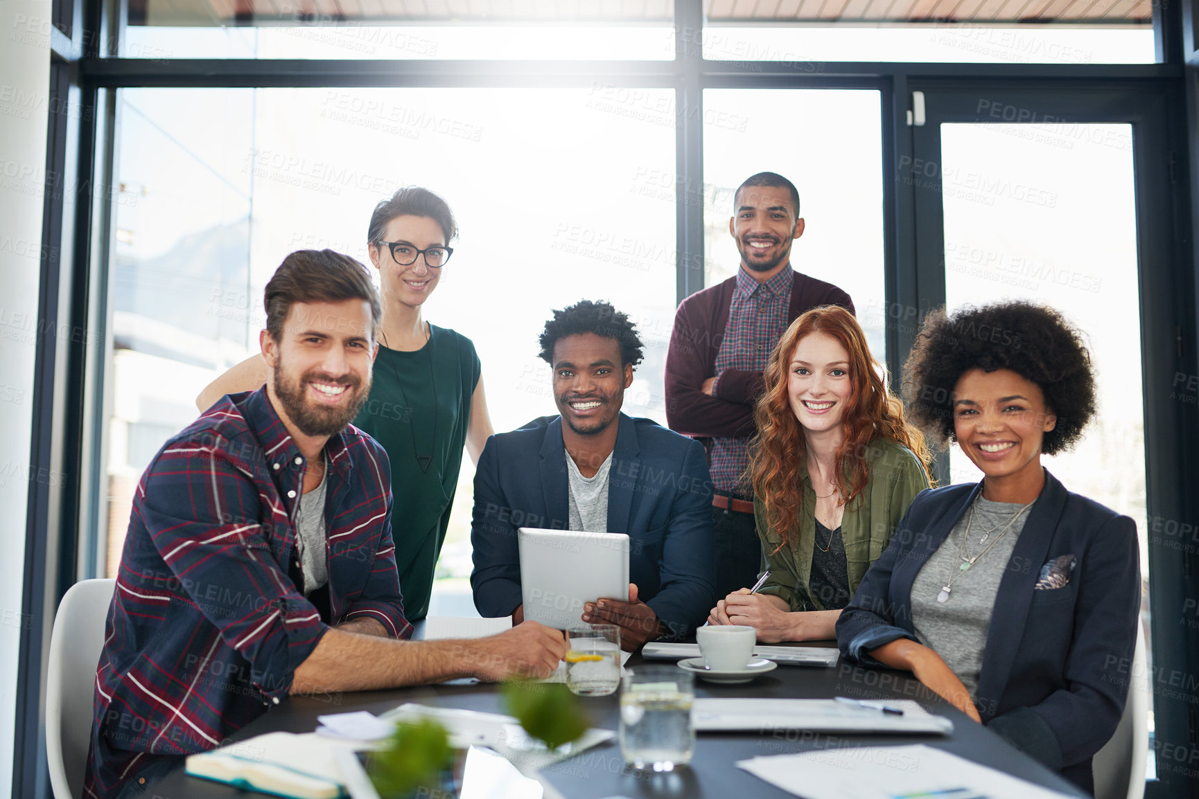 Buy stock photo Portrait, happy or business people in startup meeting for solution, conversation or discussion. Tablet, diversity or proud designers in office for planning, teamwork or online collaboration together