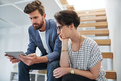 Buy stock photo Colleagues, workplace and tablet for creativity, together and connect for company, business or startup. Female person, man and technology in office on stairs for communication, ideas and vision