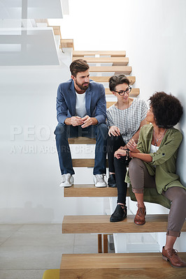 Buy stock photo Talking, diversity and team on stairs in modern office for editing career with staff, artistic and ideas. Stairway, teamwork and global people with discussion for creative agency, copywriter and job