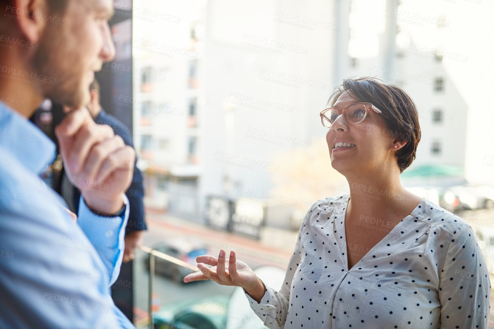 Buy stock photo Business people, discussion and office balcony with public relations staff and planning. City, working and talking professional with collaboration and teamwork with press release idea and chat