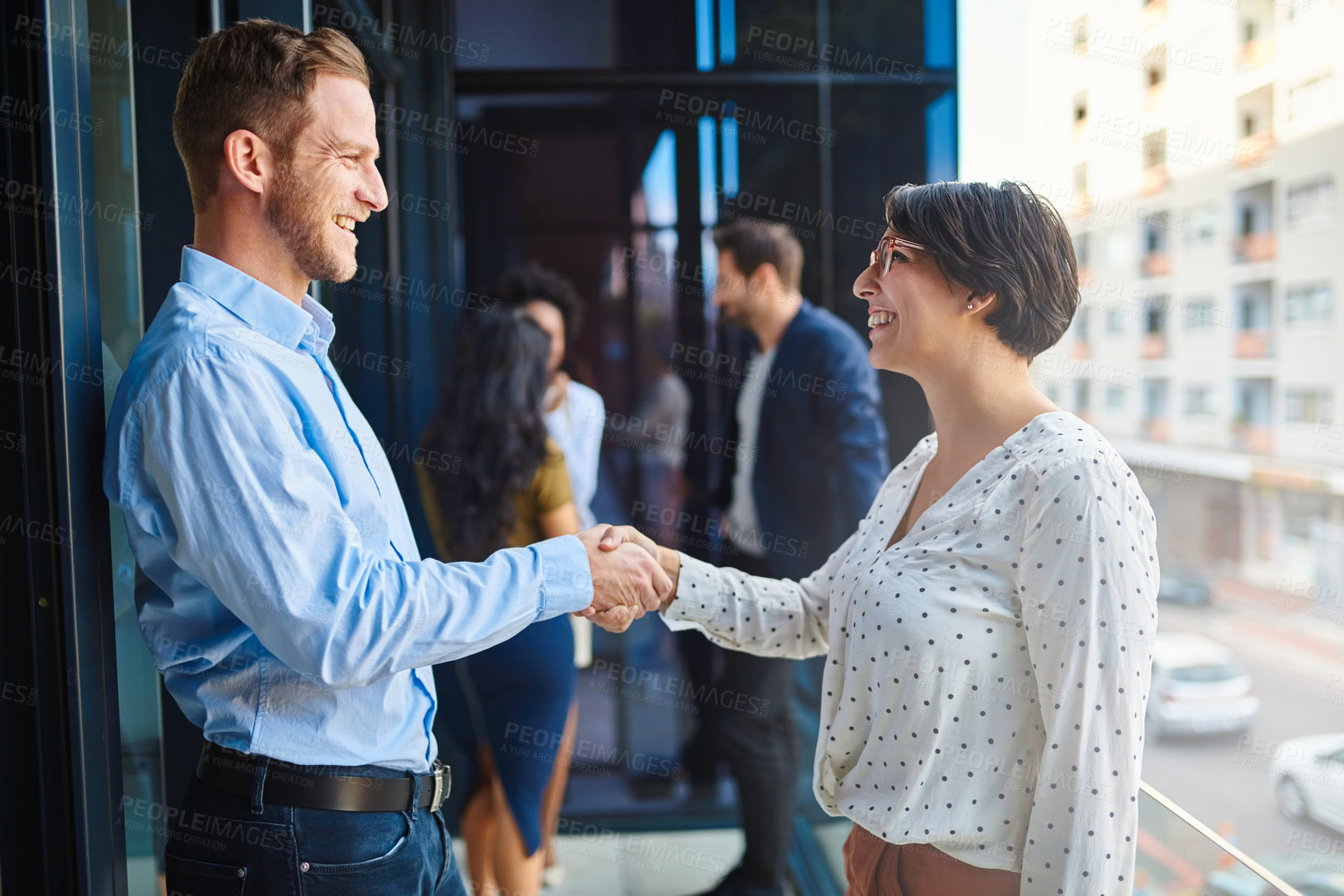 Buy stock photo Handshake, meeting and business people on office balcony for welcome, collaboration and partnership. Corporate, professional and man and woman shaking hands for agreement, b2b networking or thank you