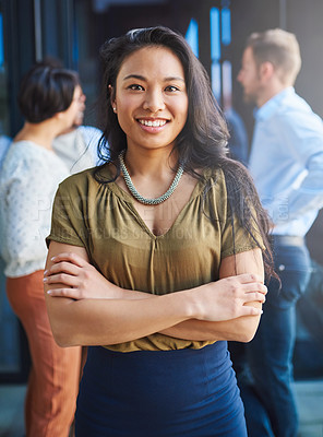 Buy stock photo Portrait of a young businesswoman standing on a balcony with her arms crossed