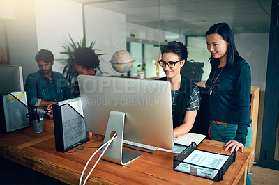 Buy stock photo Cropped shot of two young designers working in the office