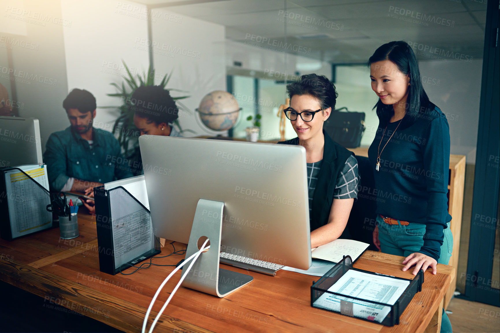 Buy stock photo Cropped shot of two young designers working in the office