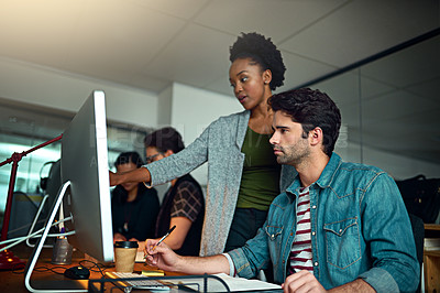 Buy stock photo Cropped shot of two young designers working in the office