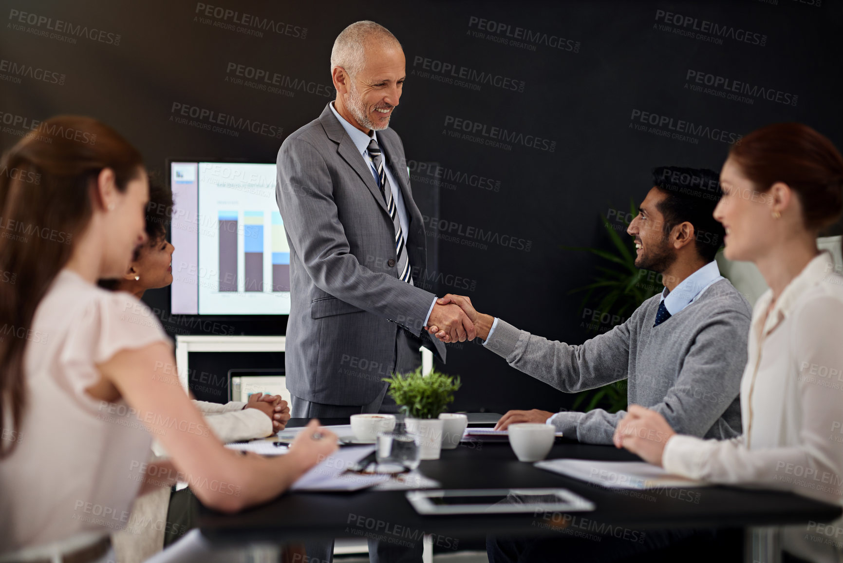Buy stock photo Presentation, people and handshake with smile for success,  deal and teamwork or collaboration. Diversity, boardroom  and happy for business achievement with congratulations as ceo and leader