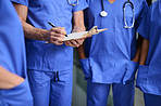 Checking their patient's record before heading in for surgery