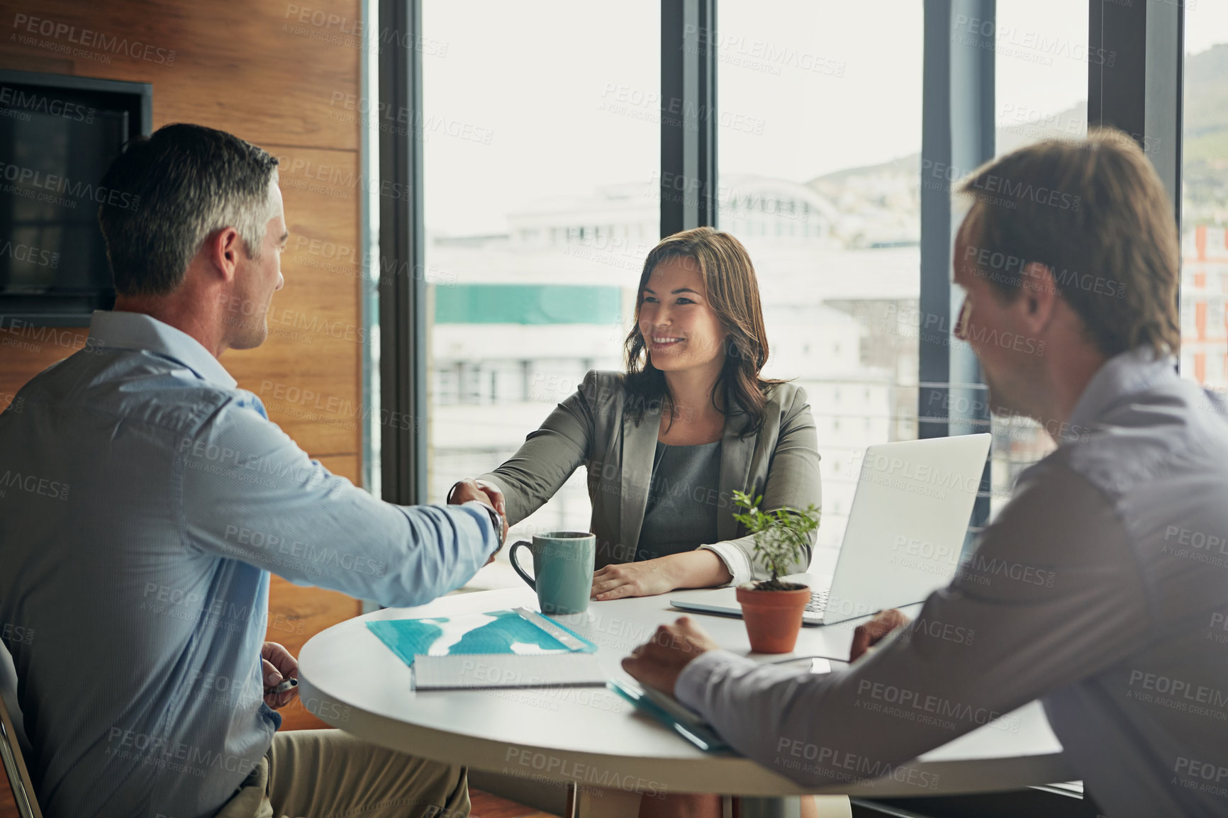 Buy stock photo Business people, handshake and meeting or interview for b2b deal, teamwork or contract in corporate office. Men and a woman shaking hands for thank you, agreement and hiring or promotion as partner