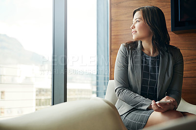 Buy stock photo Shot of a happy young businesswoman sitting in an office chair