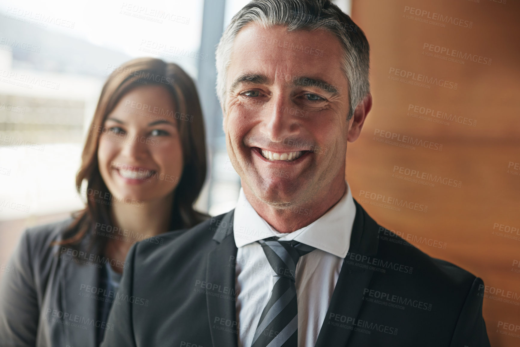 Buy stock photo Portrait of a team of professionals standing together in an office