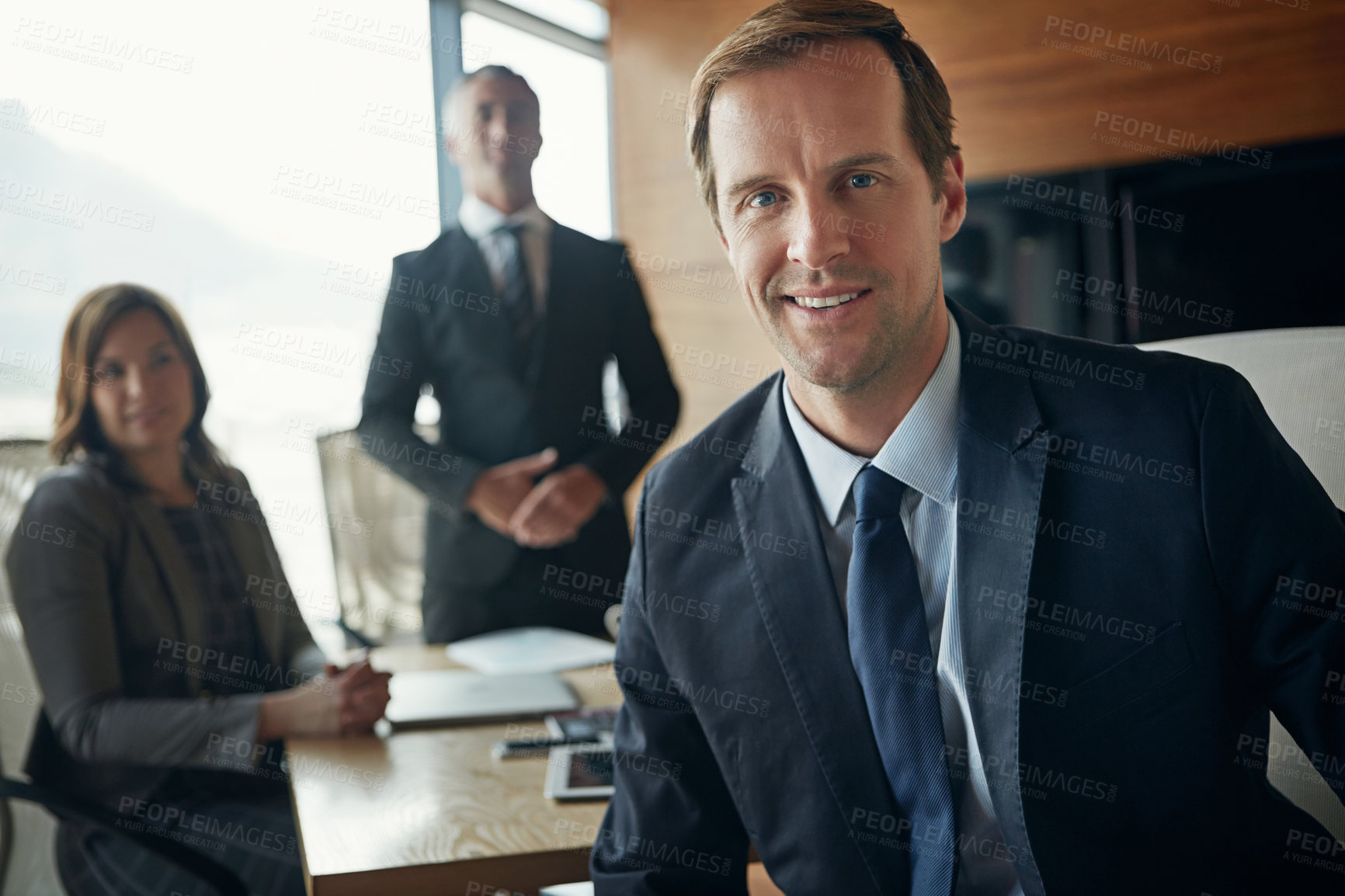 Buy stock photo Portrait of a team of professionals having a meeting in a boardroom