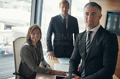 Buy stock photo Portrait of a team of professionals having a meeting in a boardroom
