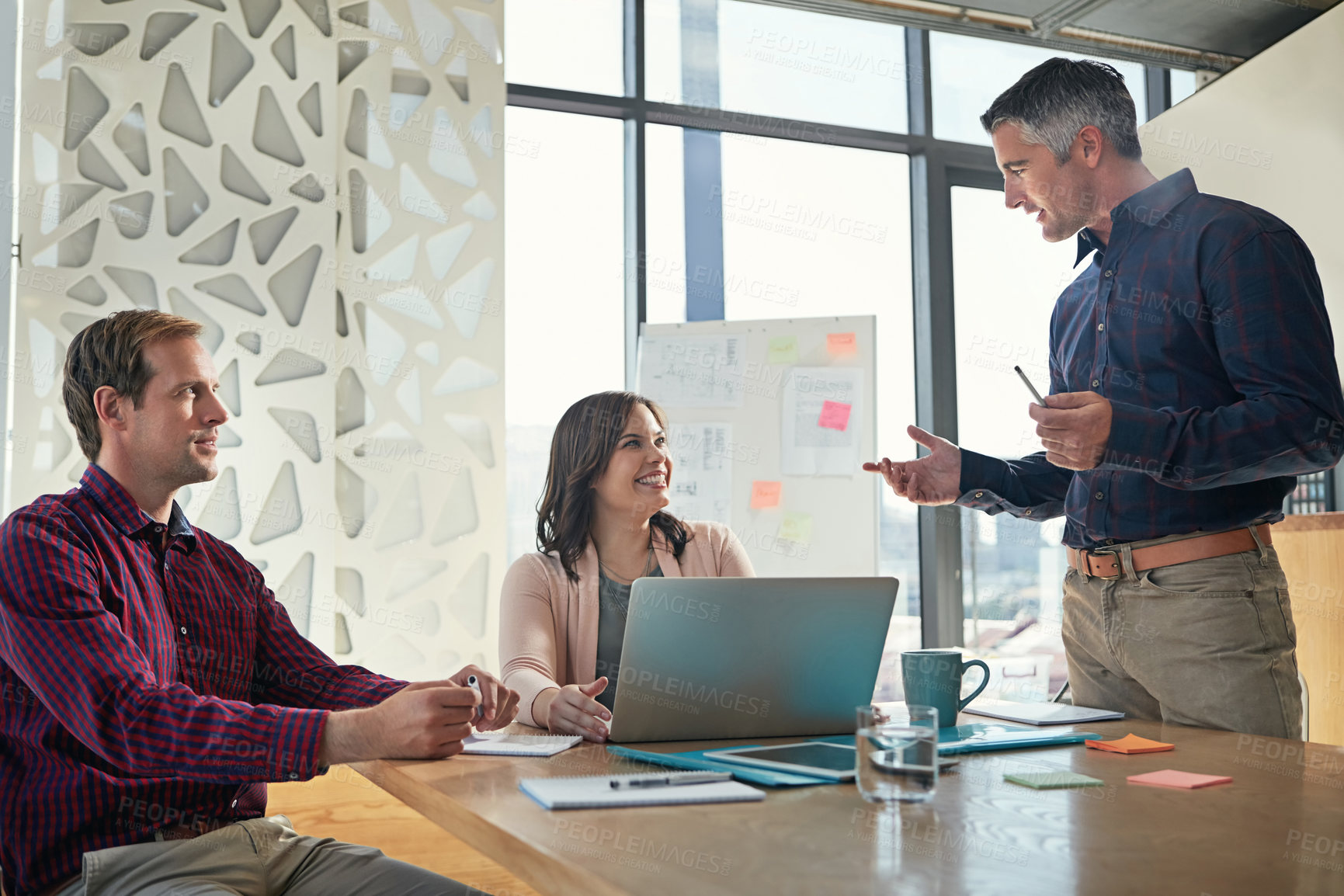 Buy stock photo Shot of a group of businesspeople having a meeting