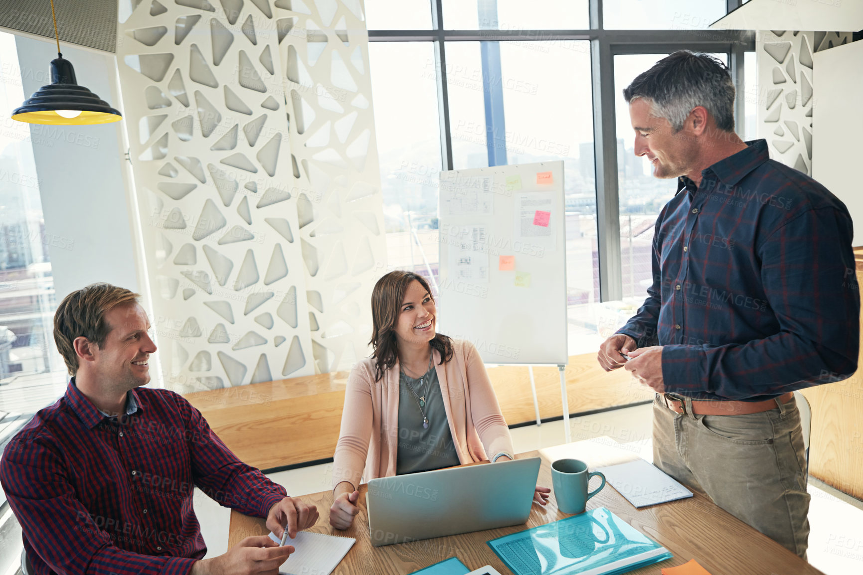 Buy stock photo Shot of a group of businesspeople having a meeting