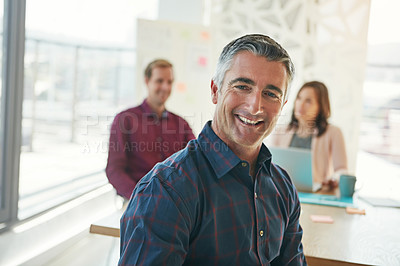 Buy stock photo Portrait of a businessman in a meeting with colleagues