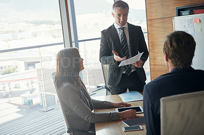 Buy stock photo Businessman, documents and team with meeting for discussion, corporate settlement or agreement at office. Business people, paperwork or form for company contract, proposal or profitable investment