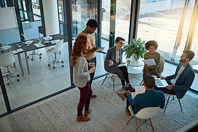 Buy stock photo Shot of a group of creatives having a meeting in a modern office
