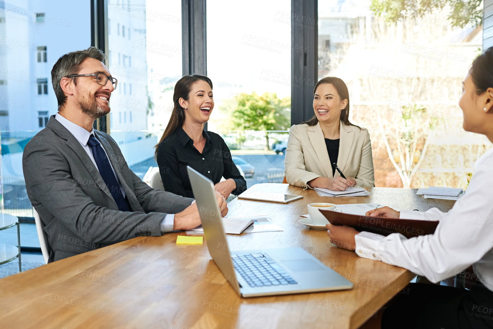 Buy stock photo Cropped shot of a group of businesspeople meeting in the boardroom