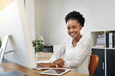 Buy stock photo Portrait of a happy young businesswoman working at her desk