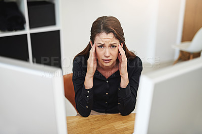 Buy stock photo Portrait of a young businesswoman looking stressed out at her desk