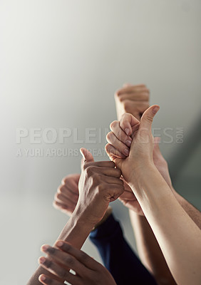 Buy stock photo Thumbs up, hands and team together in office for collaboration or teamwork with success or yes sign. People, business and gesture for agreement or diversity with trust, approval and winning.
