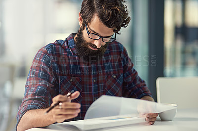 Buy stock photo Man, office and desk with working on file as graphic designer with visual, designs and ideas for project in startup business. Entrepreneur, creative and pen for drawing or sketches for task.