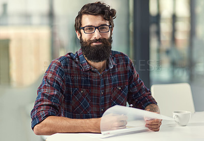 Buy stock photo Shot of a businessman working on paperwork at his desk