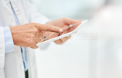Buy stock photo Man, doctor and hands on tablet for research, medical history or digital prescription at hospital. Hand of person or healthcare professional working on technology for telehealth data on mockup space