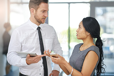 Buy stock photo Cropped shot of two colleagues meeting outside the boardroom before their presentation