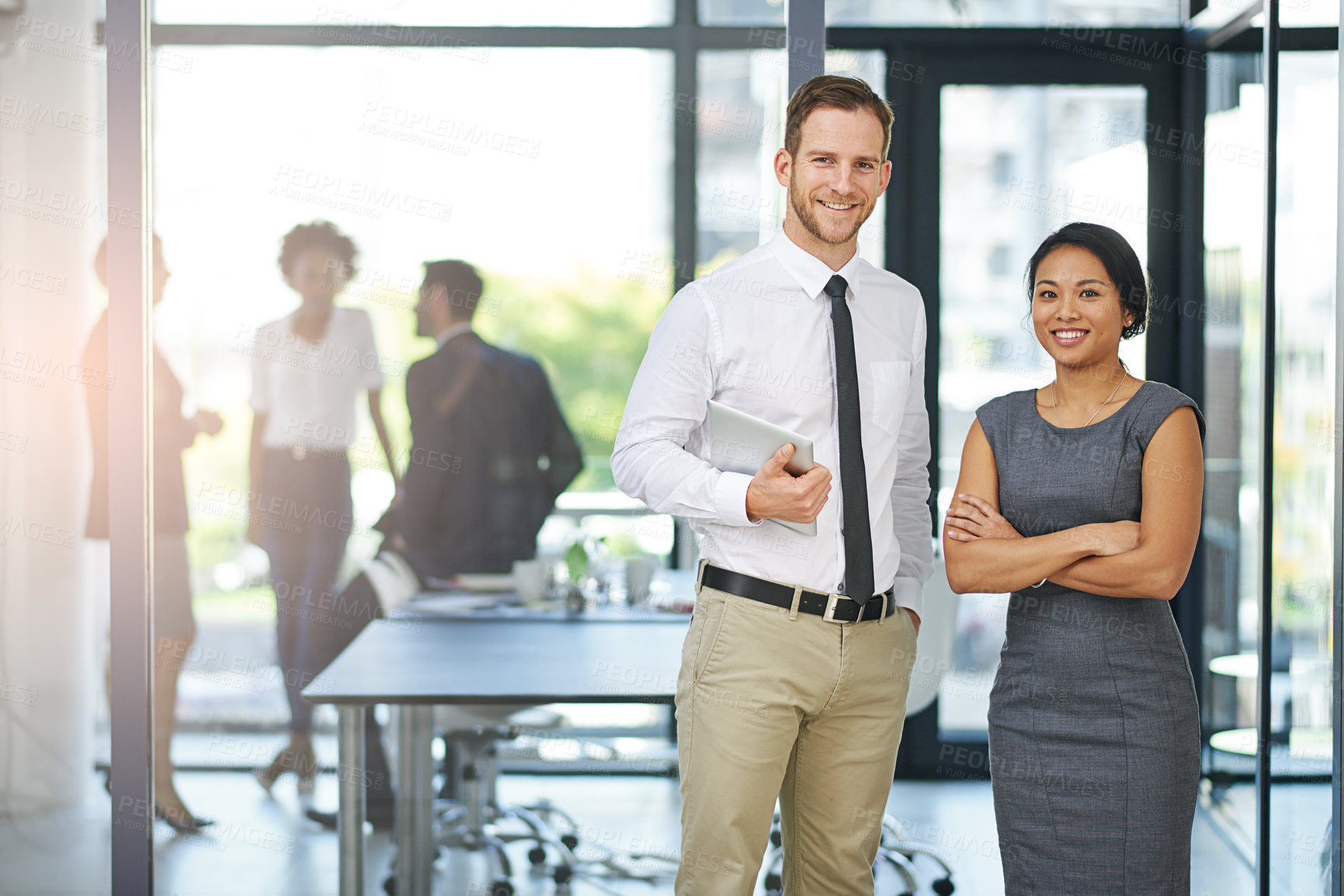 Buy stock photo Cropped portrait of two colleagues standing outside the boardroom before their presentation