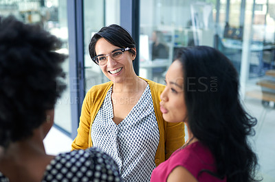 Buy stock photo Women, group and conversation in corridor at office with smile, diversity and ideas for creativity at startup. People, friends and employees in discussion, chat or teamwork in hallway at media agency