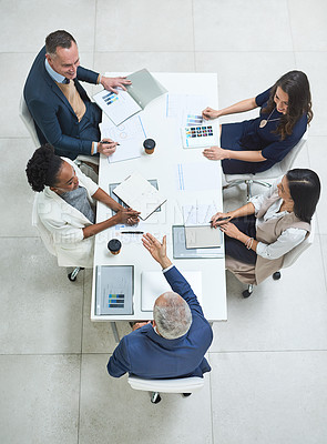 Buy stock photo Teamwork, talking and meeting group of corporate colleagues planning, brainstorming or discussing ideas. Above desk of leader asking diverse team questions and collaborating with reports or documents