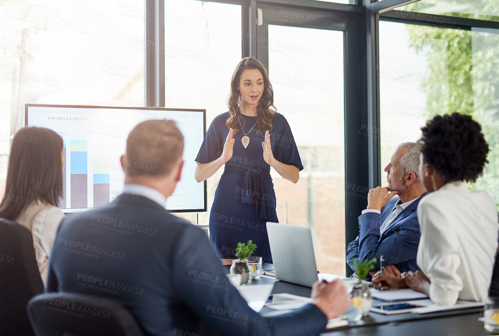 Buy stock photo Cropped shot of a businesswoman giving a presentation in a boardroom