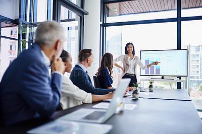Buy stock photo Cropped shot of a businesswoman giving a presentation in a boardroom